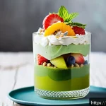 다과와 녹차 디저트 - A close-up shot of a delicate green tea dessert parfait served in a clear glass, layered with smooth...
